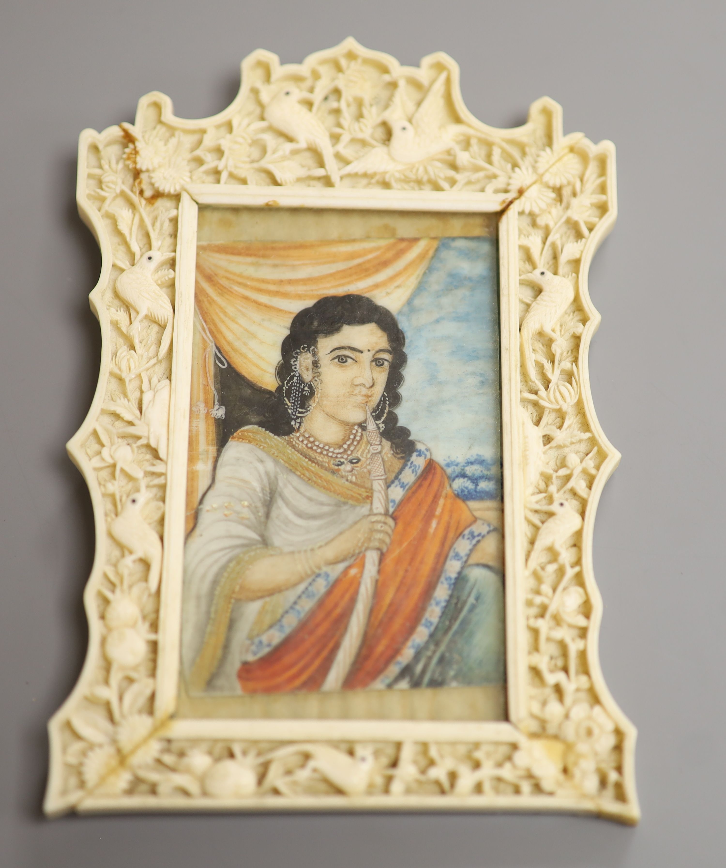 An Indian miniature gouache on ivory in a Chinese Ivory frame, circa 1900 8 x 5.5cm